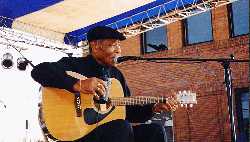 Eddie Cusic enjoys a sip during his performance